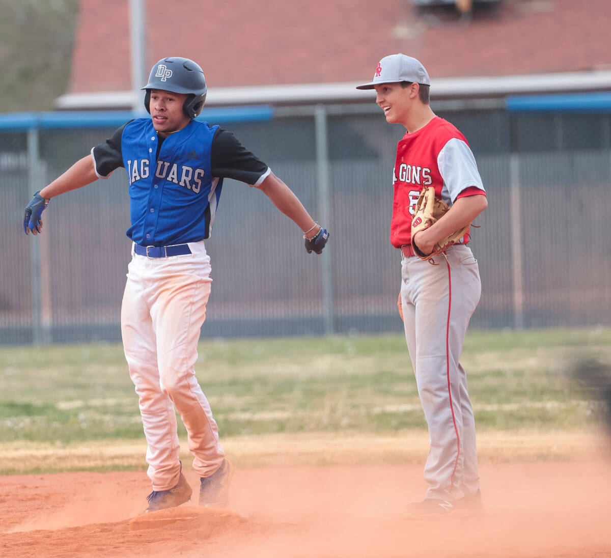 Desert Pines' Dupree Roby (3) steals second base against Doral Academy's Jack Freiert (6) durin ...