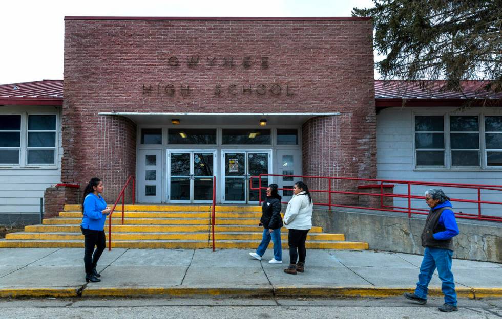 (From left) Owyhee Combined School Assistant Principal Lynn Manning John gives a tour of the ca ...