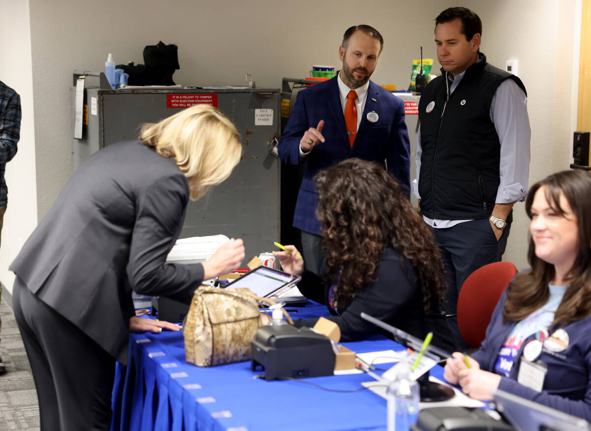 Nevada Secretary of State Cisco Aguilar, right, and Mark Wlaschin, deputy secretary for electio ...