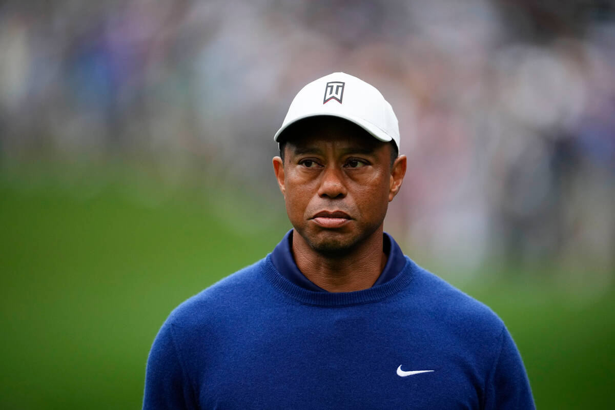 Tiger Woods walks on the 15th fairway during a practice for the Masters golf tournament at Augu ...