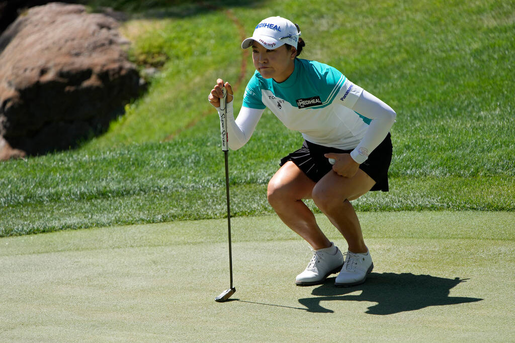 So Yeon Ryu lines up a putt on the first green during the third day of round-robin play in the ...