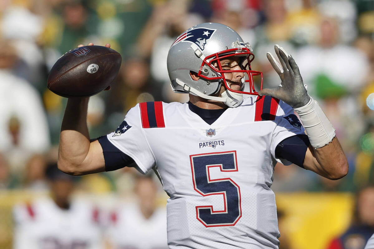 New England Patriots quarterback Brian Hoyer (5) throws during an NFL football game against the ...