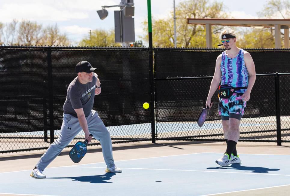 Steve Beckwith, of Henderson, left, and Cliff Walls, of Las Vegas, play pickleball at the Sunse ...