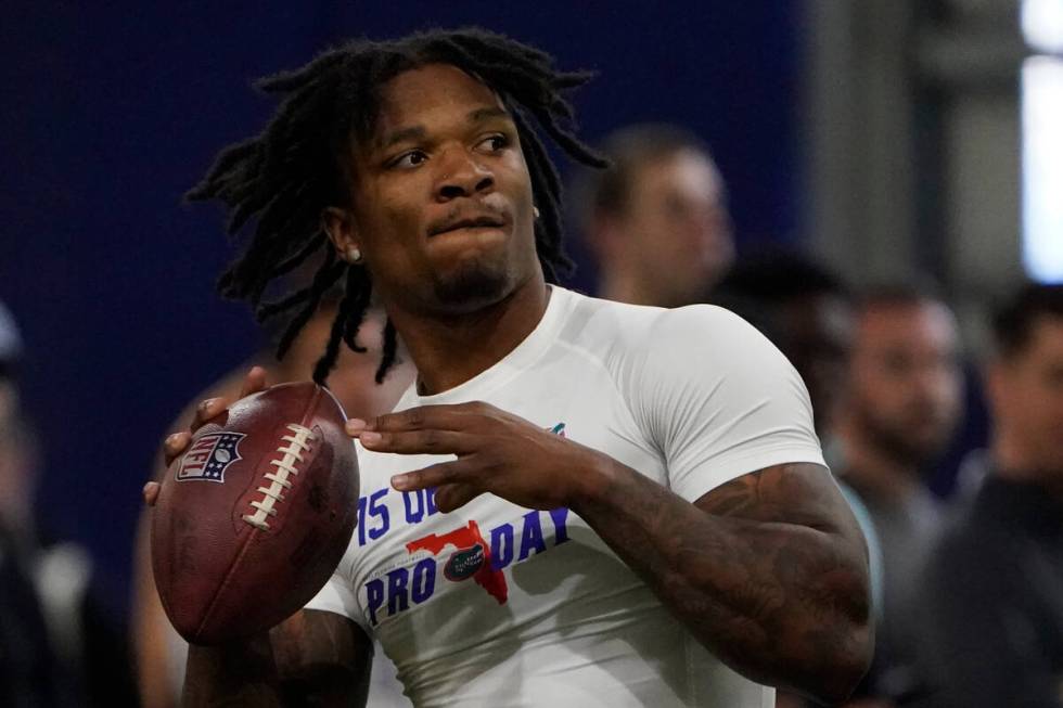 Florida quarterback Anthony Richardson throws a pass during an NFL football Pro Day, Thursday, ...