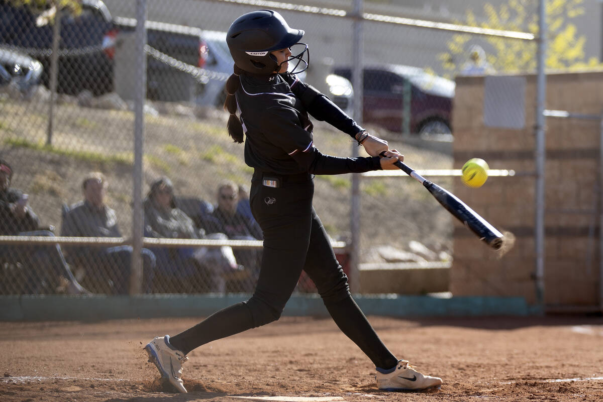 Faith Lutheran’s Jillian Molnar bats against Green Valley during a high school softball ...