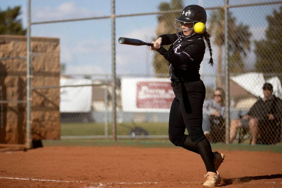 Faith Lutheran’s McKenna Young swings and misses during a high school softball game agai ...