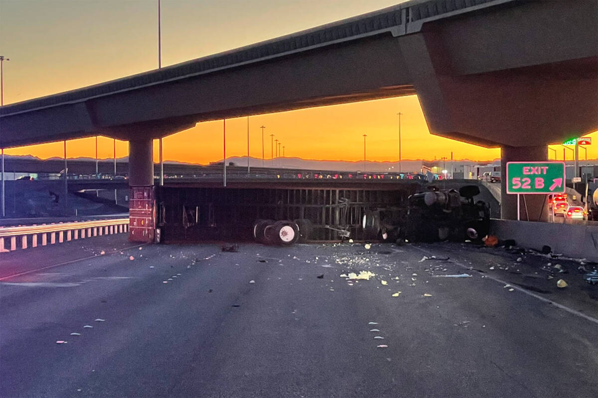 An overturned semitractor-trailer is causing headaches for commuters Wednesday, April 5, 2023, ...