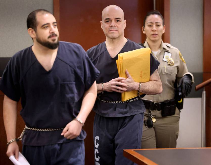 Former Clark County Administrator Robert Telles, center, who is accused of murdering Las Vegas ...