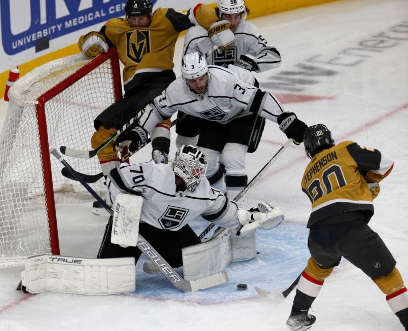 Golden Knights center Chandler Stephenson (20) scores a goal against Los Angeles Kings goaltend ...