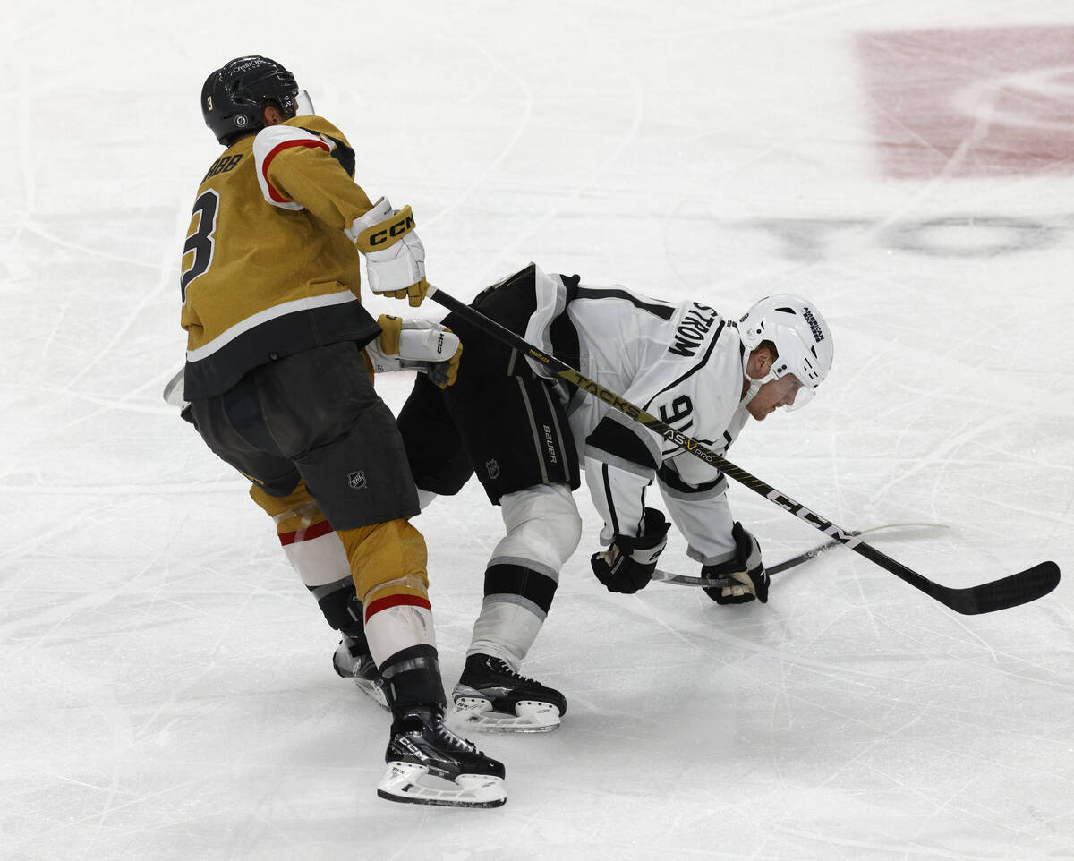 Golden Knights defenseman Brayden McNabb (3) drops Los Angeles Kings right wing Carl Grundstrom ...