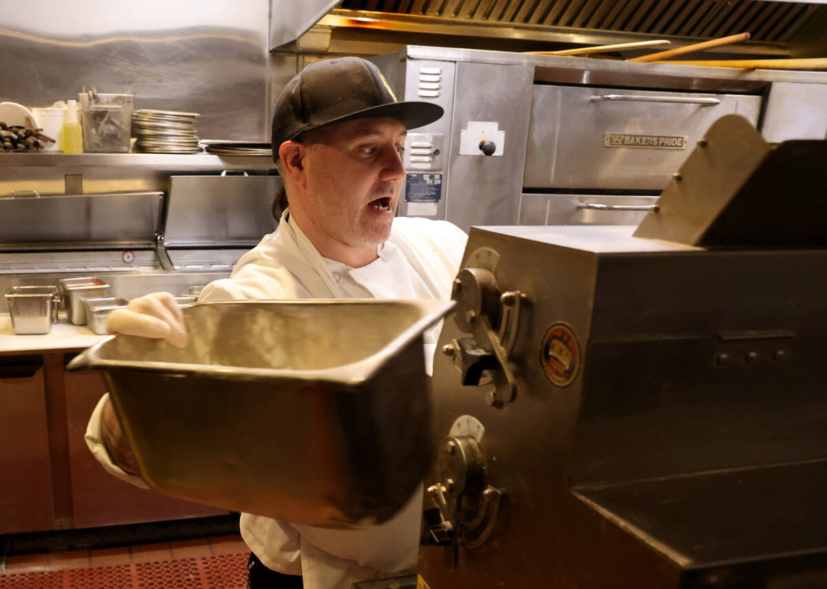 Joseph Gibson prepares pizza dough at Chicago Brewing Company at the Four Queens in downtown La ...