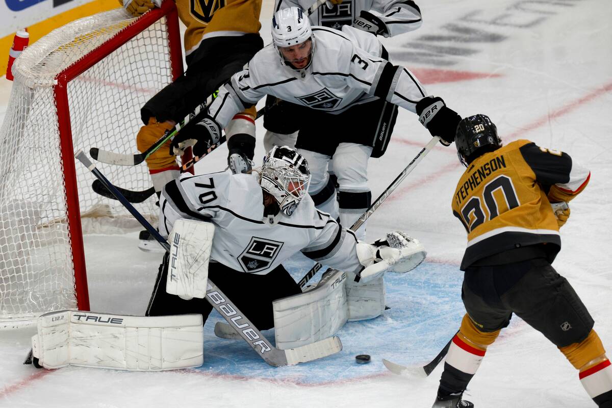 Golden Knights center Chandler Stephenson (20) scores a goal against Los Angeles Kings goaltend ...