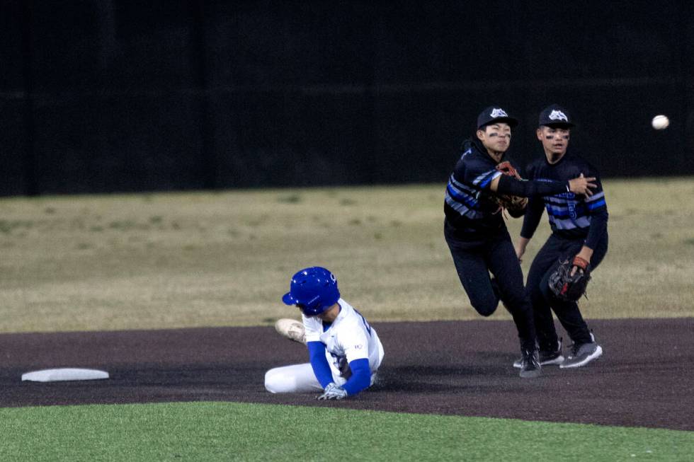 Basic shortstop Ty Southisene throws to first base after making an out at second while Bishop G ...