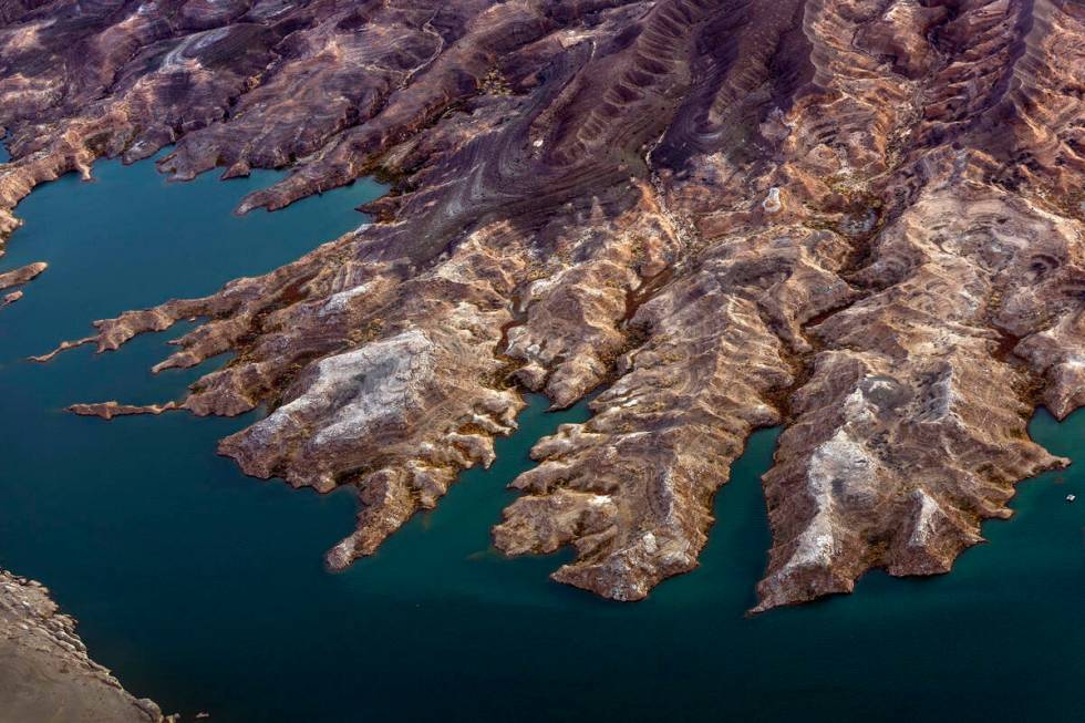 Land is exposed where once was water along the receding Lake Mead shoreline on March. 6, 2023, ...