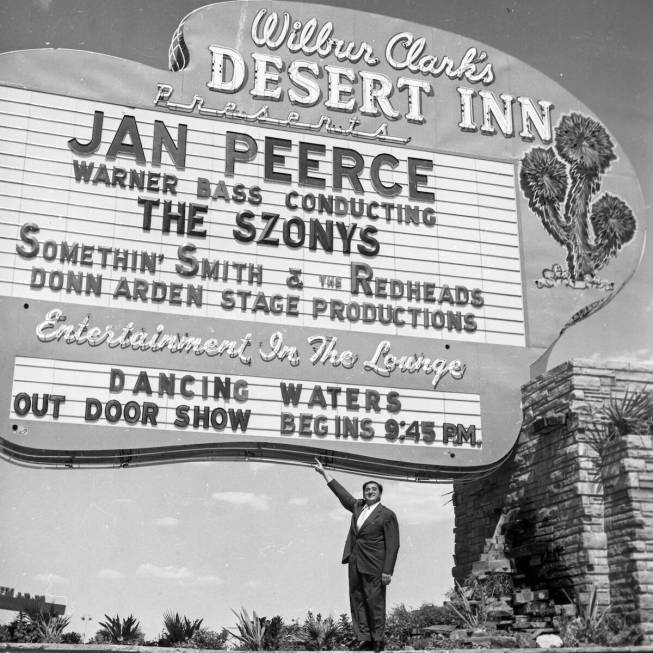 Wilbur Clark points out the Desert Inn marquee, featuring Jan Peerce, in Las Vegas on September ...