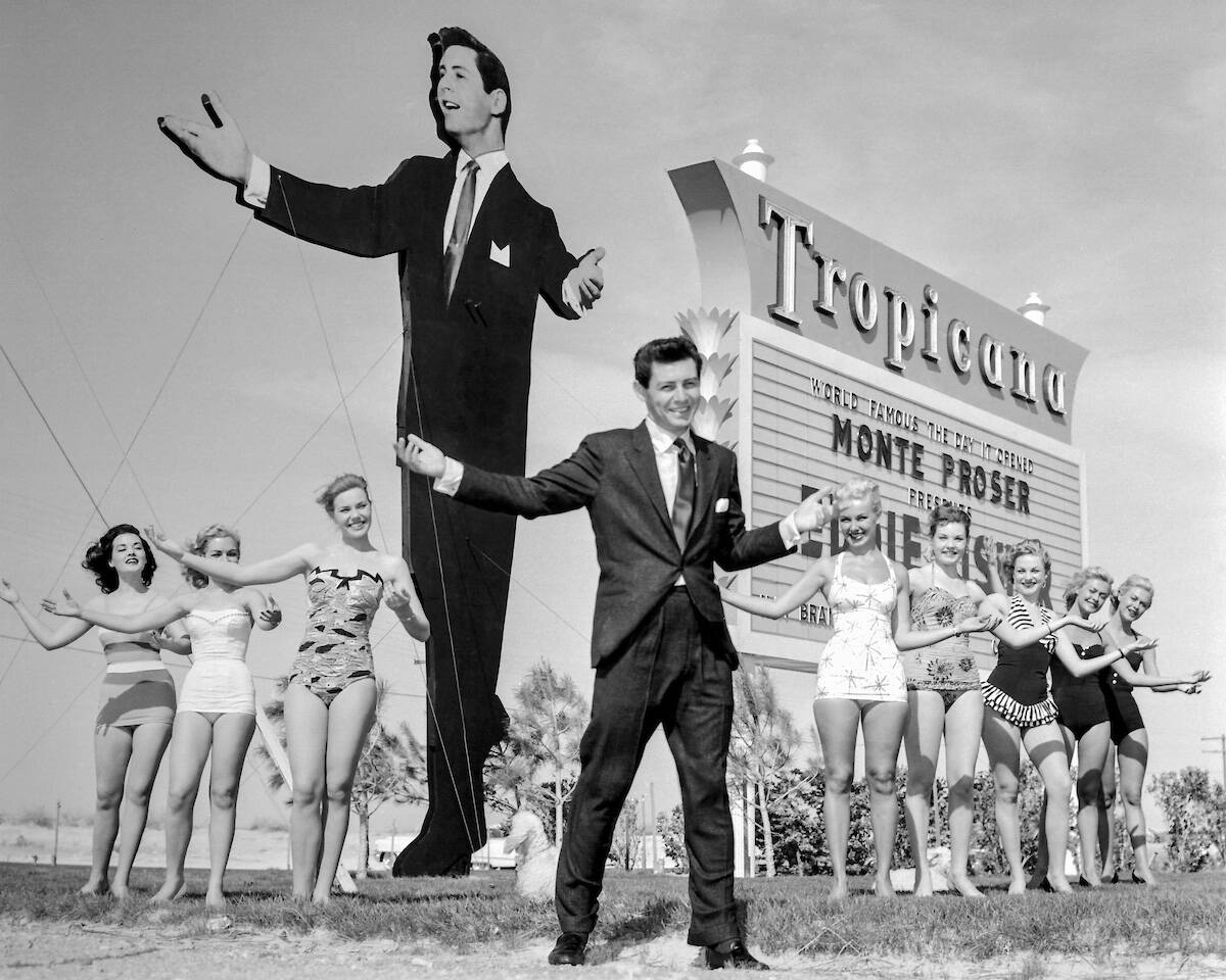 Singer/actor Eddie Fisher in front of the Tropicana marquee with showgirls on April 12, 1957. ( ...
