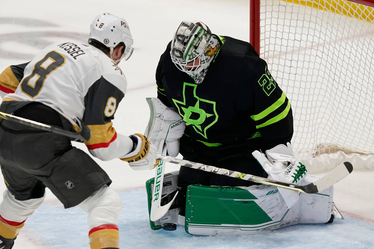 Dallas Stars goaltender Jake Oettinger (29) blocks a shot against Vegas Golden Knights right wi ...