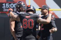 Vegas Vipers tight end Sean Price (80) speaks with Vegas Vipers quarterback Jalan McClendon (3) ...