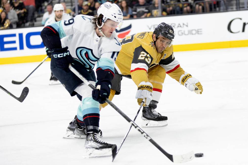 Golden Knights defenseman Alec Martinez (23) reaches to block against Seattle Kraken left wing ...