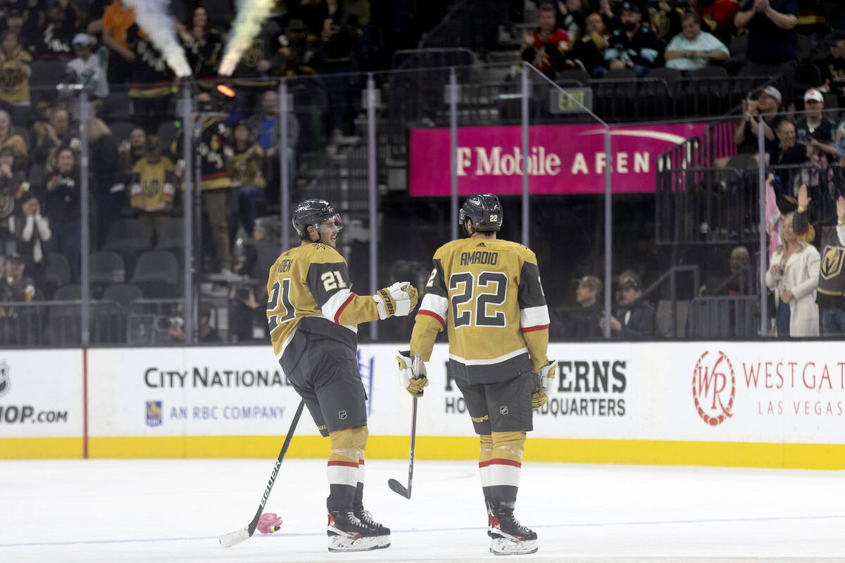 Golden Knights center Brett Howden (21) and right wing Michael Amadio (22) congratulate each ot ...