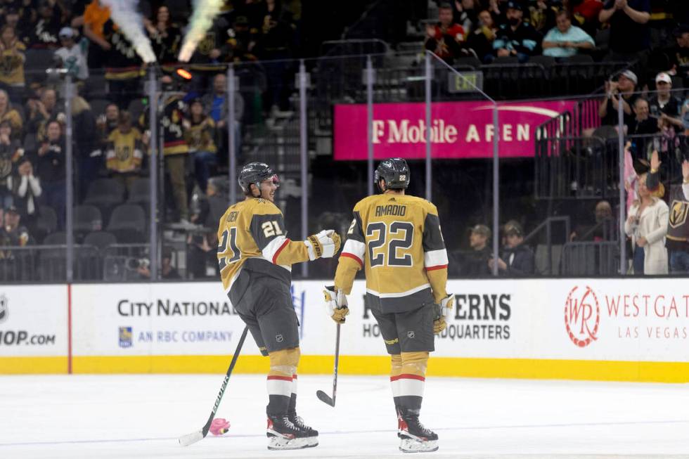 Golden Knights center Brett Howden (21) and right wing Michael Amadio (22) congratulate each ot ...