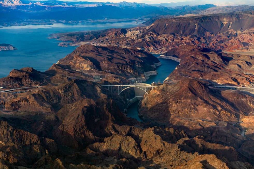 Hoover Dam with the lower Lake Mead shoreline, above, and Colorado River continuing below on Ma ...