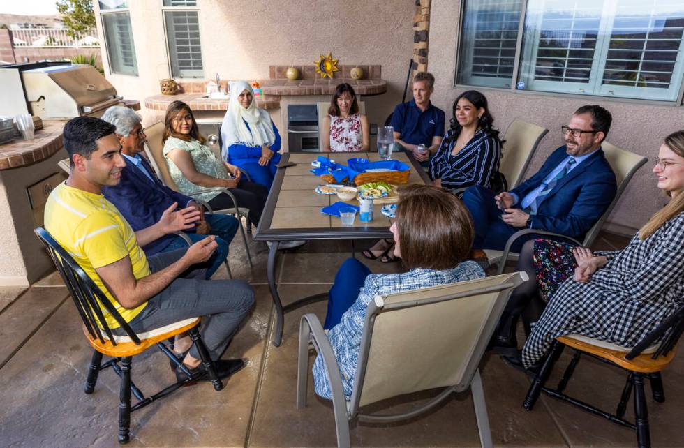 Mohammad "Benny" Shirzad, left, talks with Sen. Catherine Cortez Masto, center, while ...