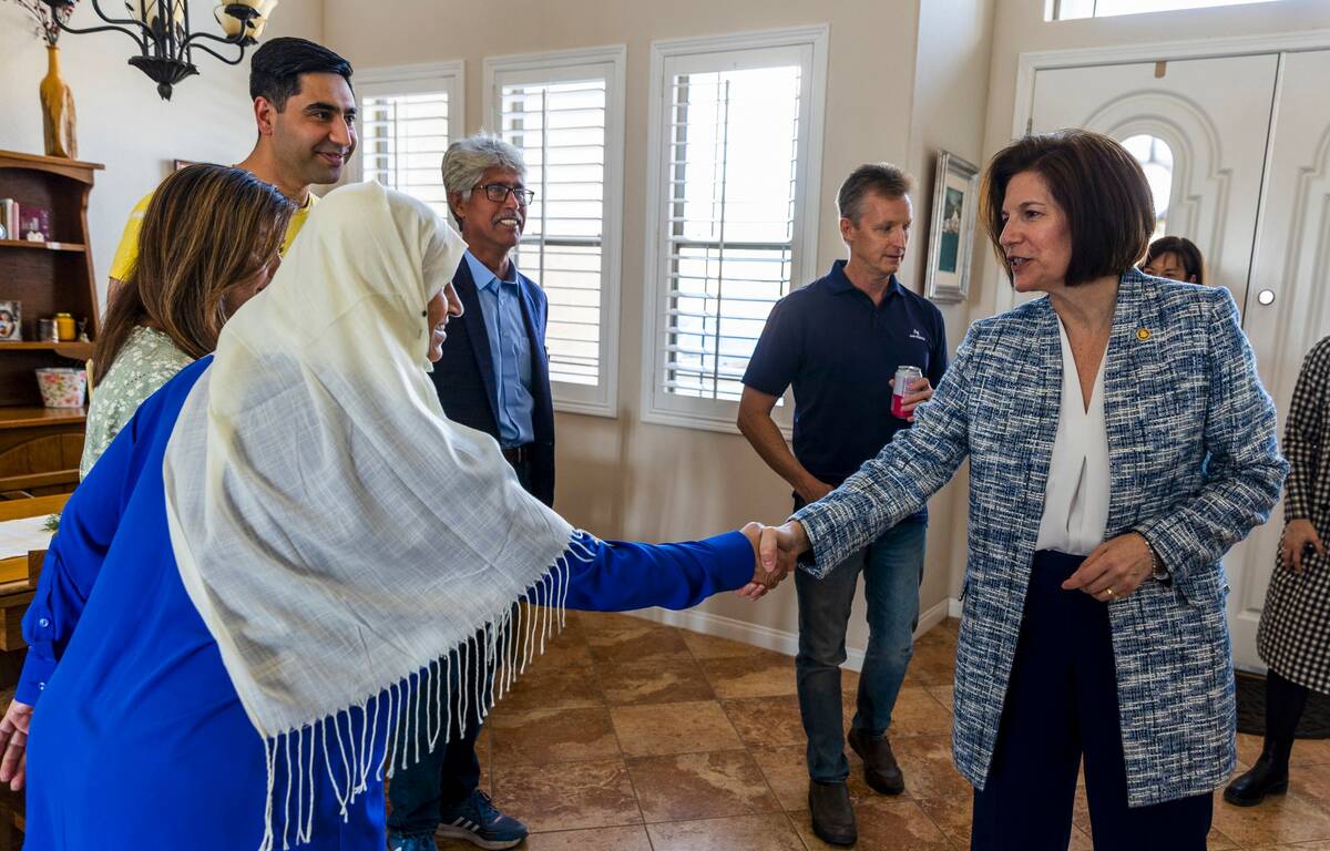 Sen. Catherine Cortez Masto right, shakes hands with mother Nazanin joined by wife Shabana, Moh ...
