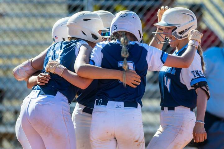 Centennial runner Teagan Clemmons, right, is celebrated for a grand slam with teammates against ...