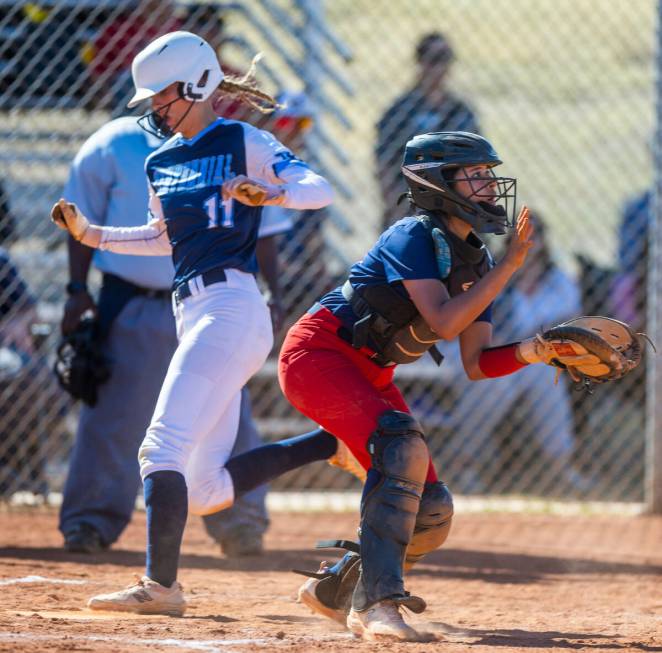 Centennial runner Jill Halas scores past Liberty catcher Vanessa Saenz in the second inning dur ...