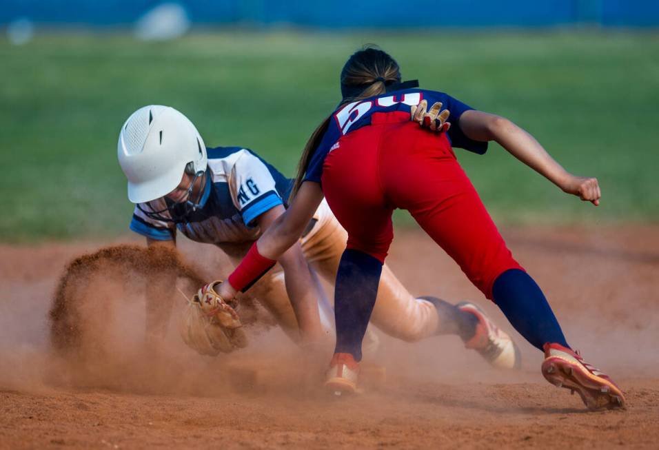 Centennial runner Rebeca Venzor-Nuno slides safely into second base against Liberty infielder J ...