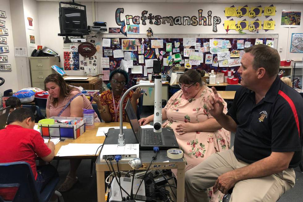 Stanford Elementary School Principal Ryan Merritt explains to his school organizational team ho ...