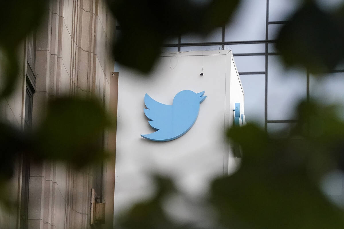 FILE - A sign at Twitter headquarters is shown in San Francisco, Dec. 8, 2022. Billionaire Elon ...