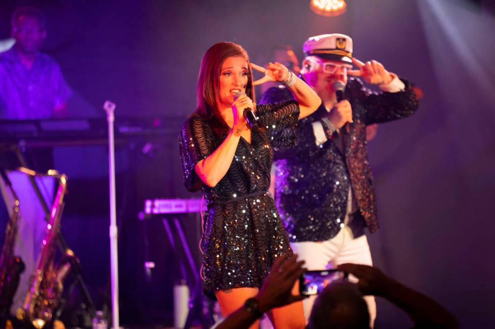 Erin Sucher, left, with her husband Kevin Sucher, of The Docksiders, perform during a show at t ...