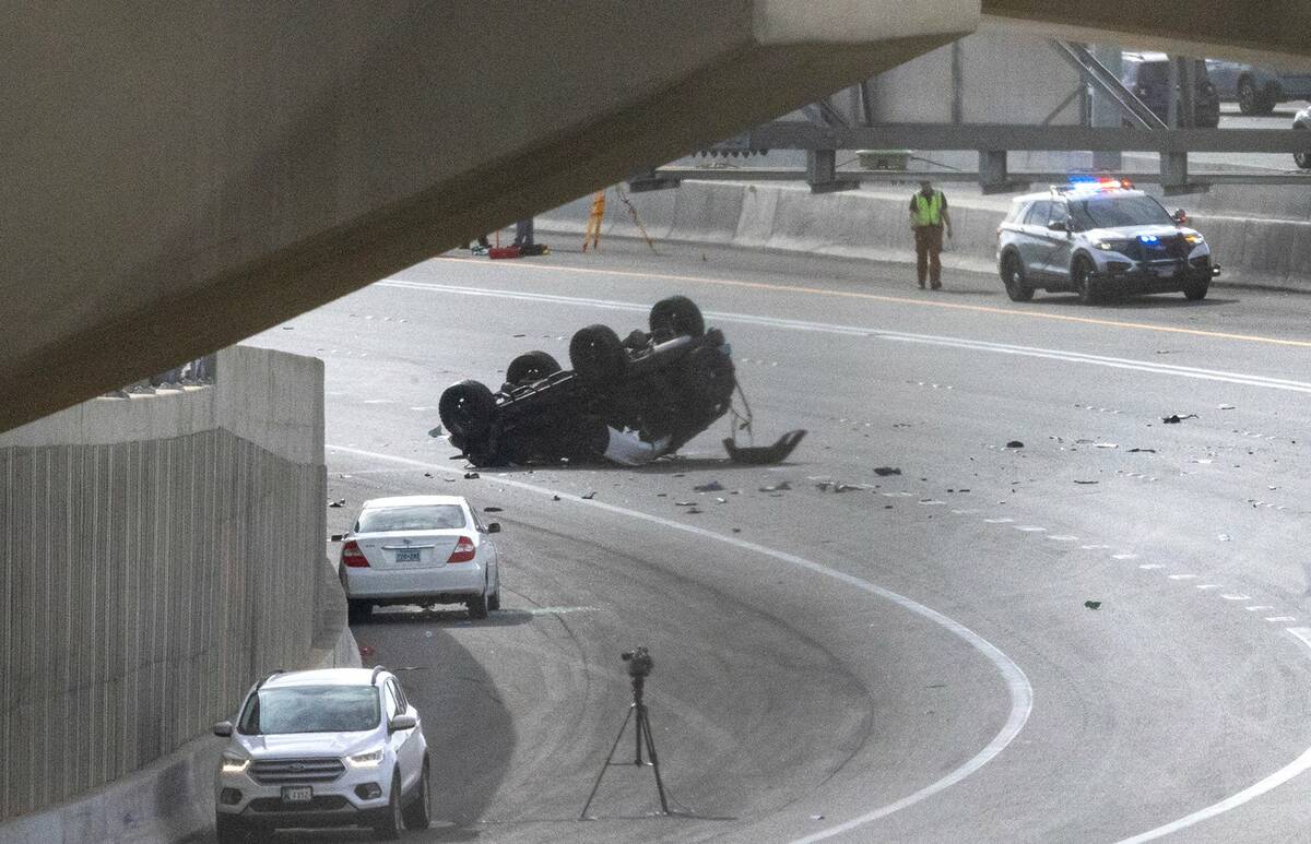 Traffic is diverted off northbound U.S. Highway 95 at Jones Boulevard as the NHP investigates a ...