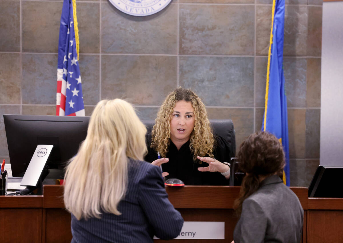 Clark County District Judge Carli Kierny talks to prosecutor Stacy Kollins, left, and Chief Dep ...