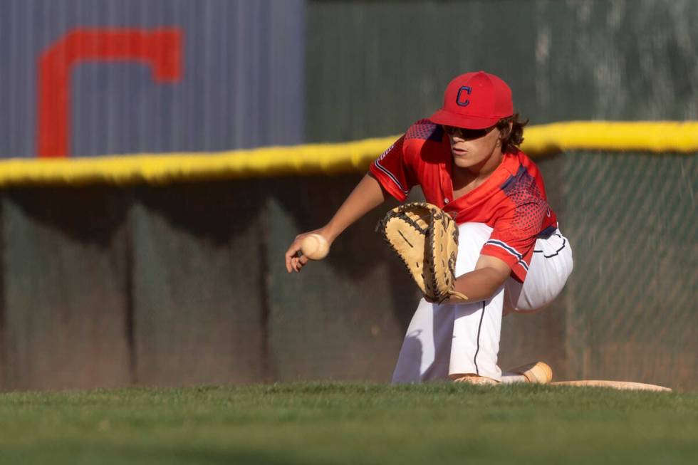 Coronado first baseman Noah Wong lunges to make the ccatch for an out during a high school base ...