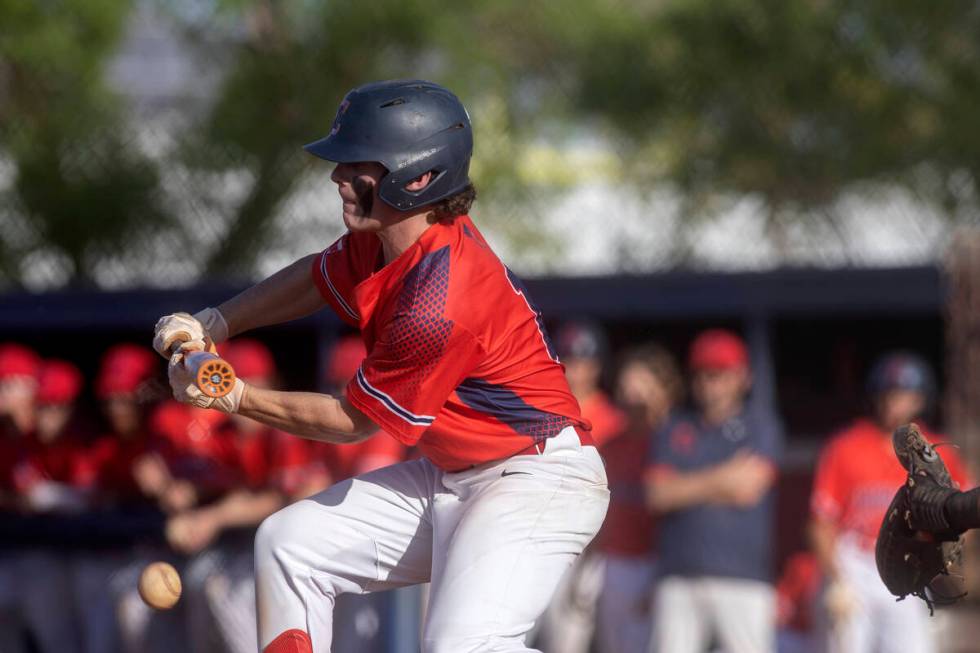 Coronado’s Ty Phillips bunts against Cimarron-Memorial during a high school baseball gam ...