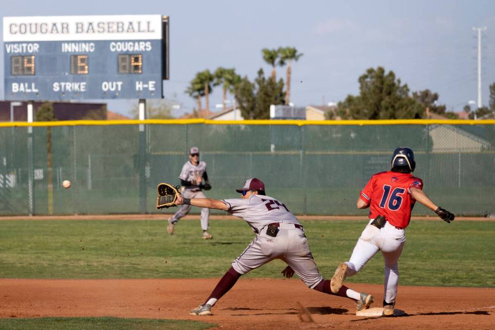 Cimarron-Memorial first baseman Samuel Ponce (24) reaches to catch while Coronado’s Nick ...