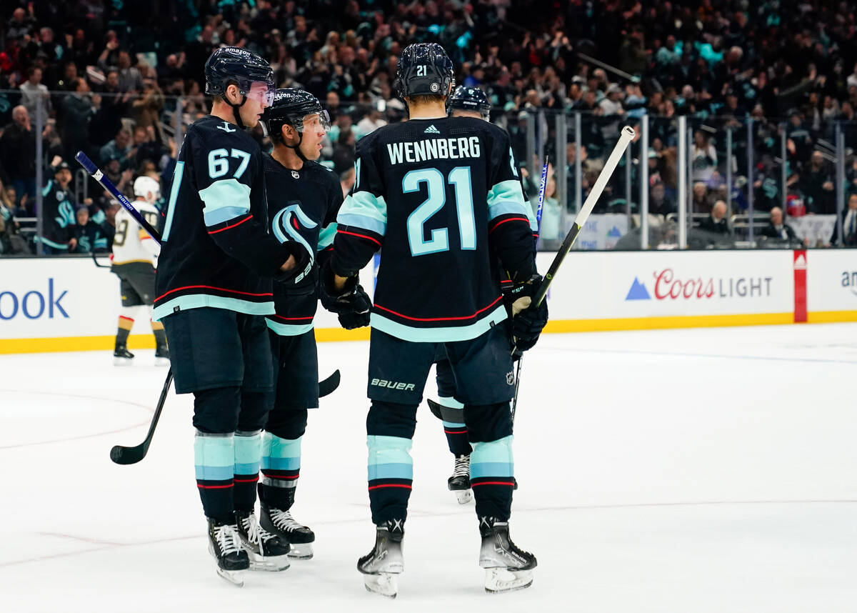 Seattle Kraken center Jaden Schwartz, second from left, celebrates his goal against the Vegas G ...