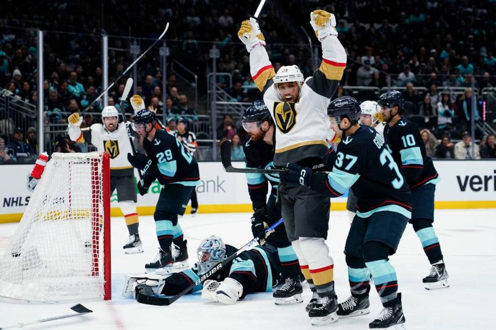 Vegas Golden Knights defenseman Alec Martinez, front left, celebrates his goal against Seattle ...