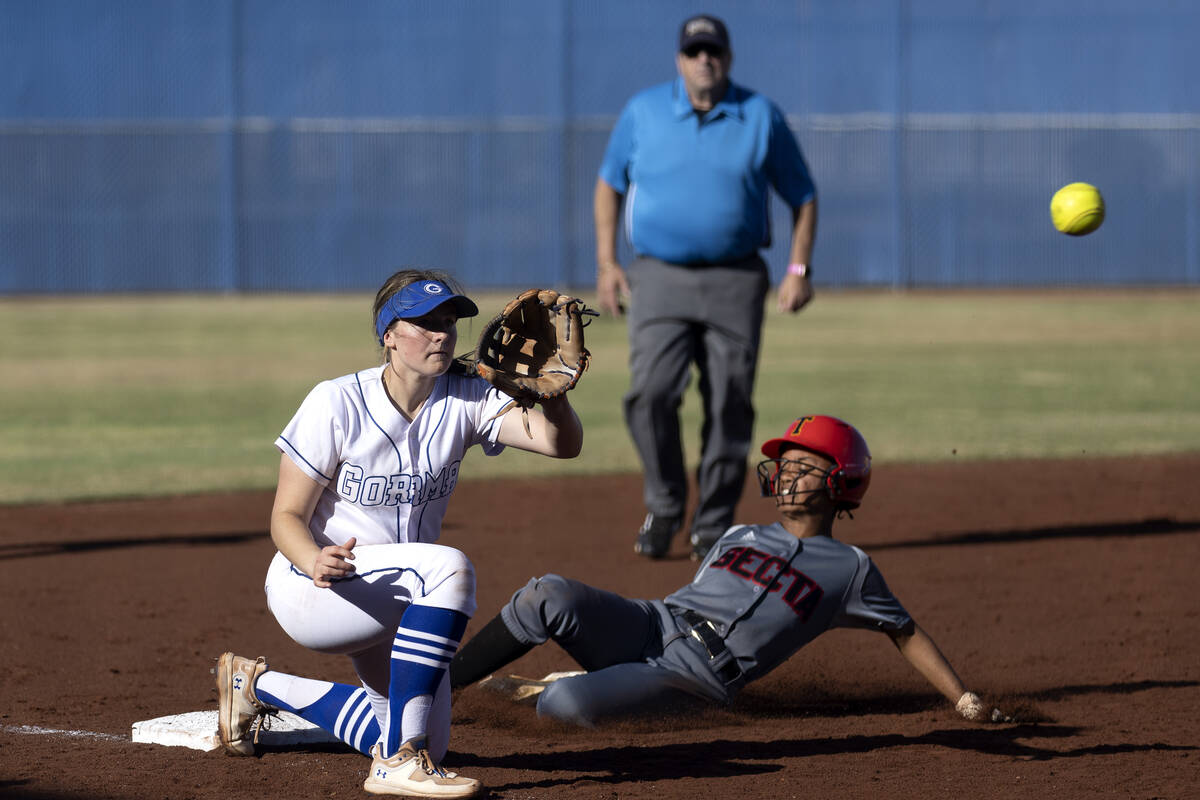 Bishop Gorman’s Samantha Lefever lunges to catch while Tech’s Bea Robinson slides ...