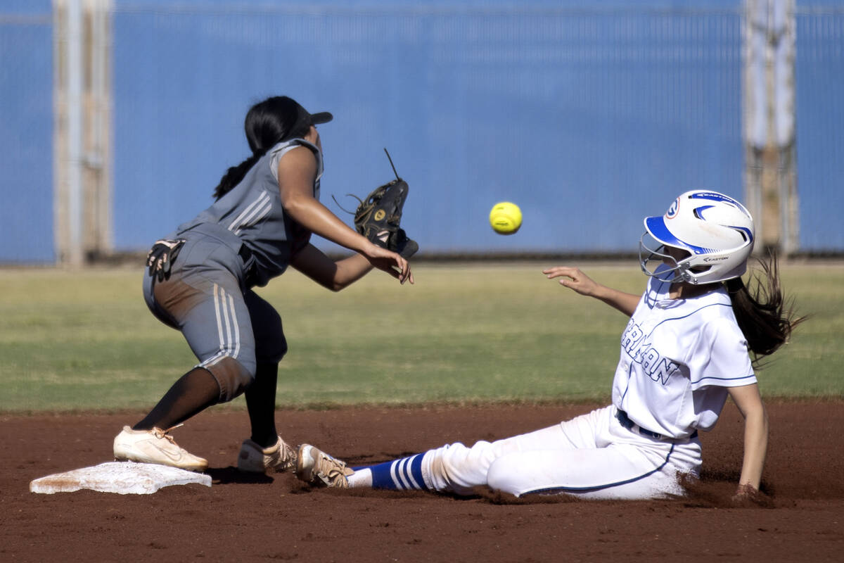 Tech’s Aysia Suyat reaches to catch while Bishop Gorman’s Tiffany Gonzales slides ...