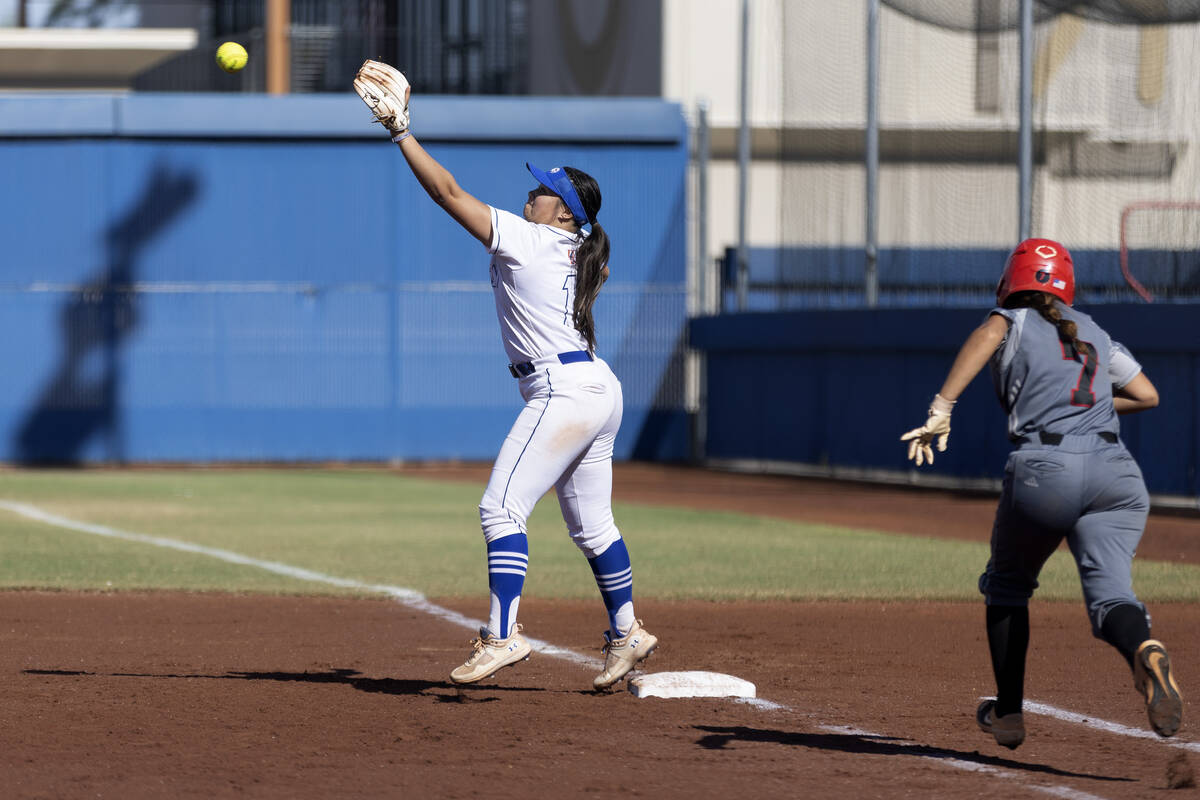 Bishop Gorman’s Kyla Acres reaches to catch for an out while Tech’s Marlene Salda ...