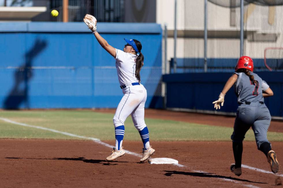 Bishop Gorman’s Kyla Acres reaches to catch for an out while Tech’s Marlene Salda ...