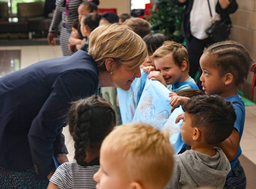 U.S. Rep. Susie, D-Nev., Lee talks to Zion Williams, 5, at the Durango Hills Community Center a ...