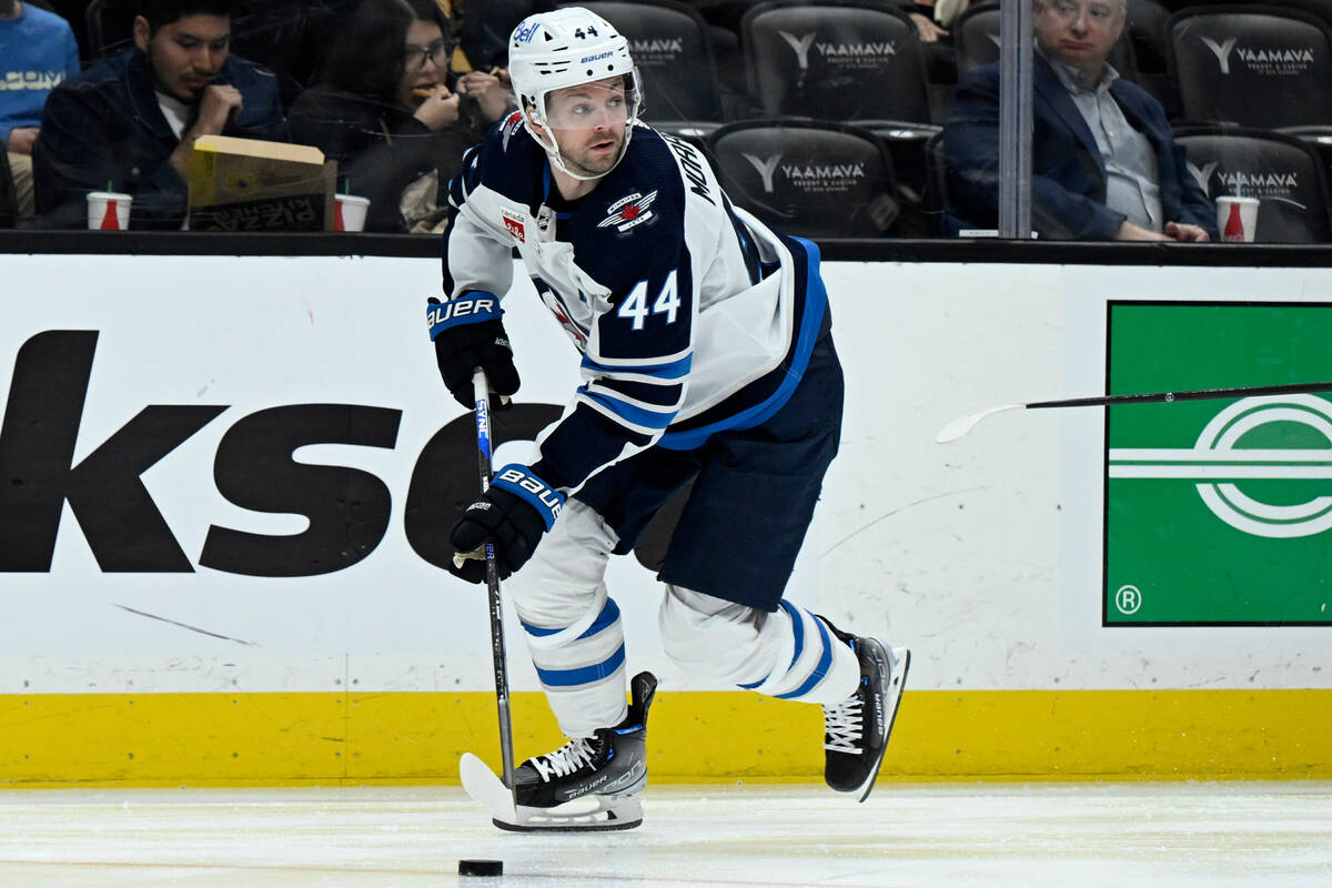 Winnipeg Jets defenseman Josh Morrissey skates during the first period of an NHL hockey game ag ...