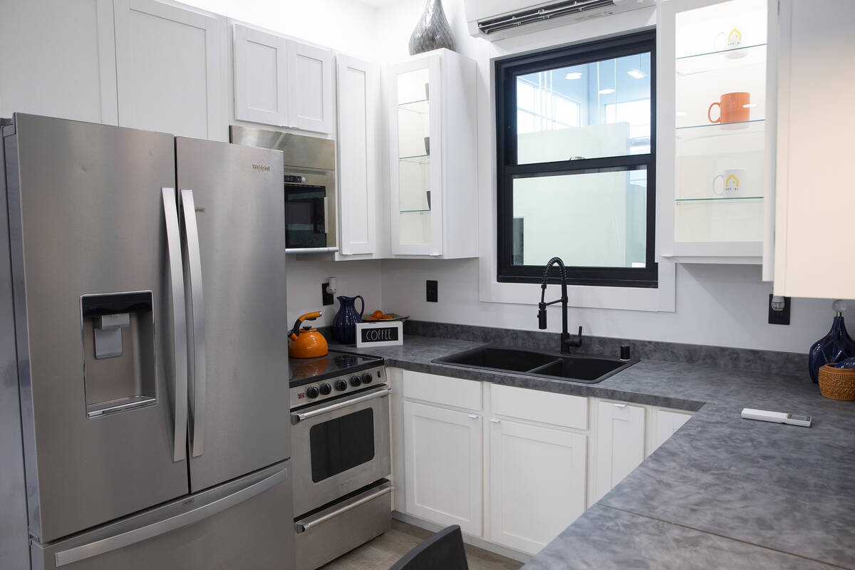 The kitchen in a 375-square-foot Boxabl Casita includes a full-sized refrigerator as well as an ...