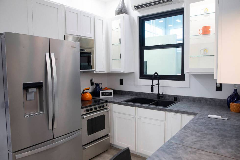 The kitchen in a 375-square-foot Boxabl Casita includes a full-sized refrigerator as well as an ...