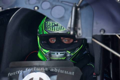 NHRA driver Matt Hagan sits in his funny car before the second Nitro qualifying session during ...